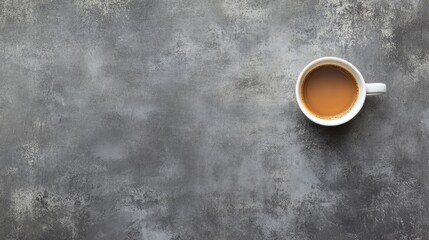 Aerial View of Coffee Cup on Gray Surface with Room for Text