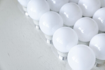 round white LED light bulb. many modern light bulbs on a white table