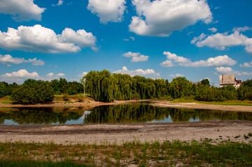 Water level control. Environmental impact. Ecosystem disruption. Green nature in summer. Summer...