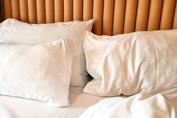 Cozy Bedroom Interior with White Pillows on Luxurious Bed for Relaxation and Comfort
