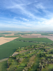Rolling green wheat fields and a lush golf course as seen from hot air balloon ride over Walla Walla, Washington State.