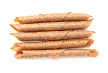 Delicious fruit leather rolls on white background, top view