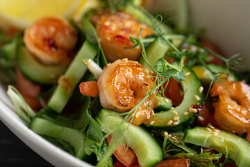 Closeup on gourmet salad with fresh vegetables and shrimp