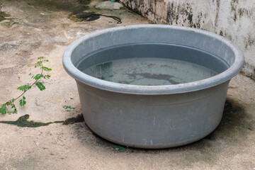 Fototapeta premium Rainwater catch basin,Rainwater stored in a bucket.