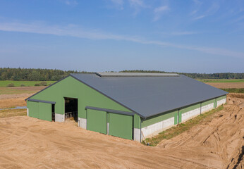 Large Green Agricultural Farm Warehouse Building on a Farm in the Countryside