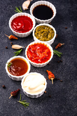 Set of different sauces. Ketchup, mustard, pesto