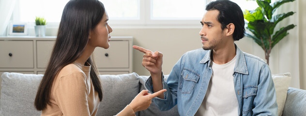 Fototapeta premium Breakup and depressed, asian young quarrel couple love fight relationship in trouble. Different people are emotion angry. Argue wife has expression upset with husband. Problem of family people.