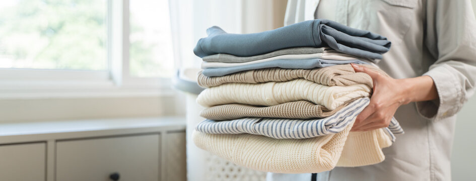 Housewife folding laundry clothes prepare before put in closet
