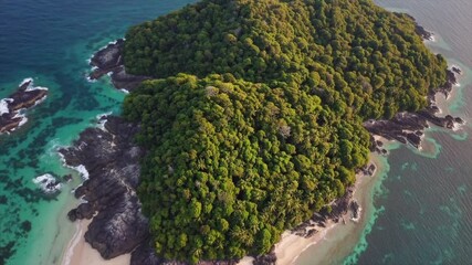 Explore a lush tropical island with vibrant greenery and clear waters at sunset, offering a serene escape from daily life