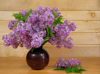 Bouquet of lilacs in a ceramic vase