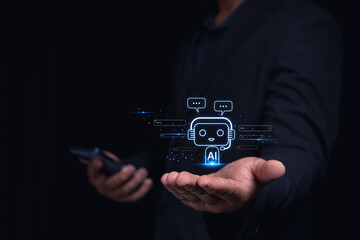 A person in a suit holds a phone, with a holographic AI chatbot icon appearing above their open palm.