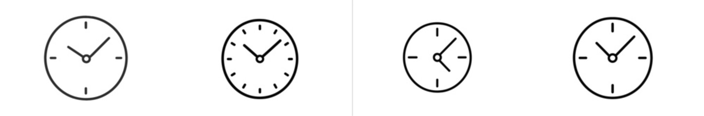 Clocks showing different times and styles in a minimalist design setting with black and white aesthetic