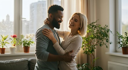 Happy Interracial Couple Embracing in Sunlit Living Room, Showing Love and Affection in Domestic Setting