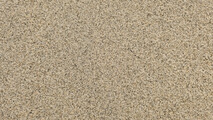 Uniform Beige Sand Texture Landscape. The sand appears dry and compact, showing no significant variation in pattern or content. Close Up of Natural Beige Sand Surface.
