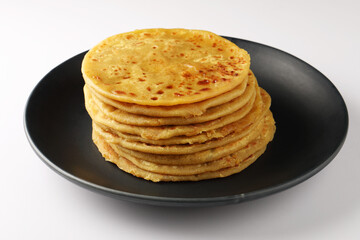 Puran Poli is an Indian sweet flatbread stuffed with chana dal, jaggery, ghee and cardamom and is usually eaten at Holi or Gudi Padva festival. Healthy sweet dessert.
