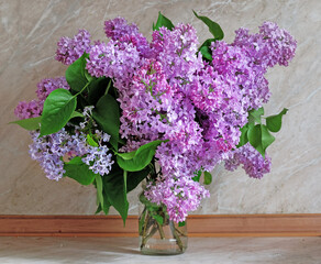 Bouquet of purple lilac in the kitchen