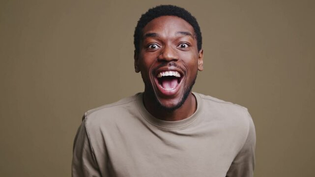 Photo of impressed cheerful person open mouth toothy smile cant believe isolated on khaki color background