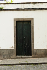 Clean White Wall with Dark Door