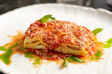 Closeup on portion of gourmet italian lasagna bolognese dish