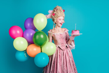Photo of charming cheerful lady dressed renaissance garment celebrate birthday isolated on blue color background