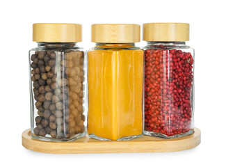 Many different aromatic spices in jars isolated on white