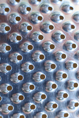close - up of a metal grater textured background