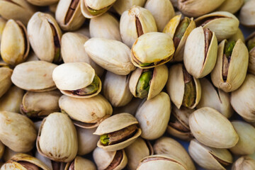 Top view of roasted pistachios.Natural antioxidant food concept.Fresh organic pistachios presented as a healthy vegan snack. Ideal for clean eating and wellness content. Top view of natural pistachios