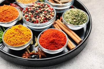 Different aromatic spices on light grey table, closeup