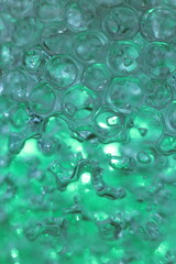 abstract green background of hydrogell balls, macro photo