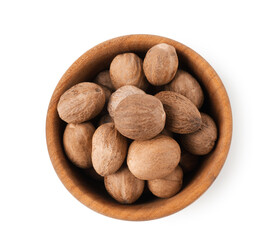 Naklejka na ściany i meble Nutmegs in bowl isolated on white, top view