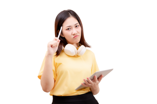 A young woman in a yellow shirt holds a tablet and pen, wearing headphones around her neck, with a thoughtful expression.