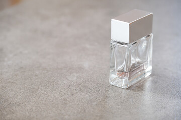 Perfume bottle on a gray background