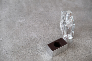 Perfume bottle on a gray background