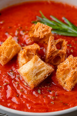 Homemade tomato soup on vintage table