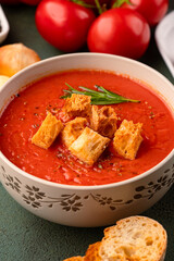 Homemade tomato soup on vintage table