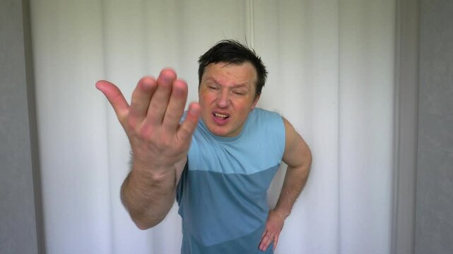 Human emotions, scandalous man explains loudly and shouts and waves his hands. Body gestures and facial expressions of aggression. Slow motion on a white background