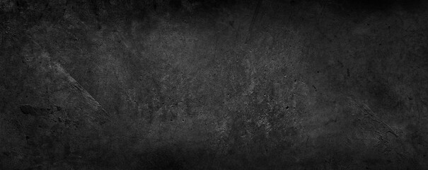 Dark grey textured concrete wall black grunge background