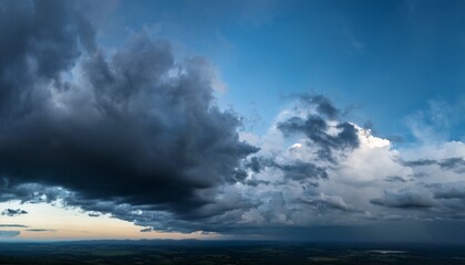 Obraz premium dramatic overcast sky at evening panoramic shot scenic blue gray clouds before the storm scenic cloudscape before the rain blue hour stormy cloudscape dark thunderstorm sky wide image