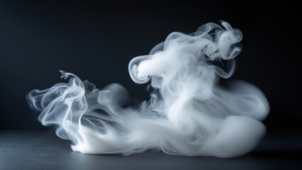 Abstract shape of white smoke softly blurred over a dark background