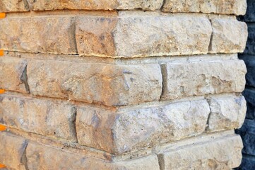 Classic old windows on a stone wall. Elements of European traditional architecture