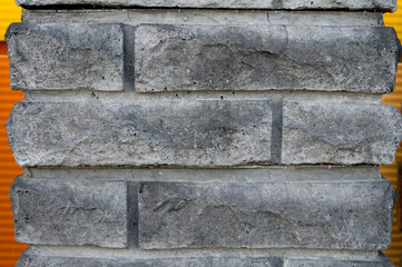Classic old windows on a stone wall. Elements of European traditional architecture