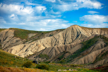 Semi-desert landscape with badlands in inland Sicily, Italy, on a sunny, cloudy spring day