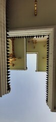 Classic Architectural View of Temple Structure with Ornate Decorations and Unique Design Elements