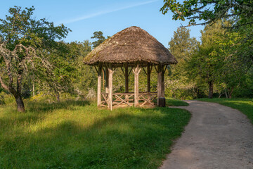 View of the ancient wooden gazebo in the apple orchard in the Mikhailovskoye Estate of the Pushkin...