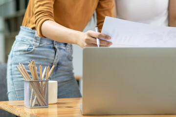 business consultant is advising an Asian businesswoman on her business investment after reviewing...