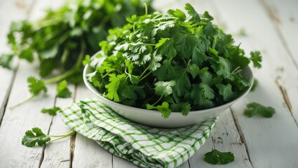 Fototapeta premium Fresh cilantro on a white wood table