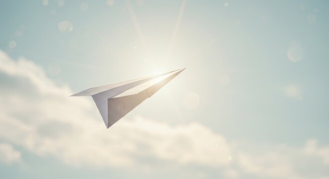 Paper Airplane Flying in the Sky - Conceptual Photo