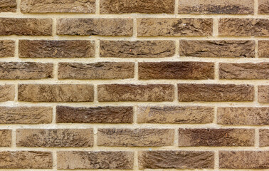 The texture of a brown lined wall . Beautiful fence