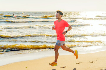 Man enjoying a sunny run along the tranquil beach while waves gently lap at the shore