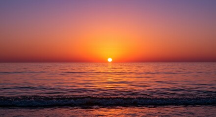 Fototapeta premium Sunset over calm ocean water